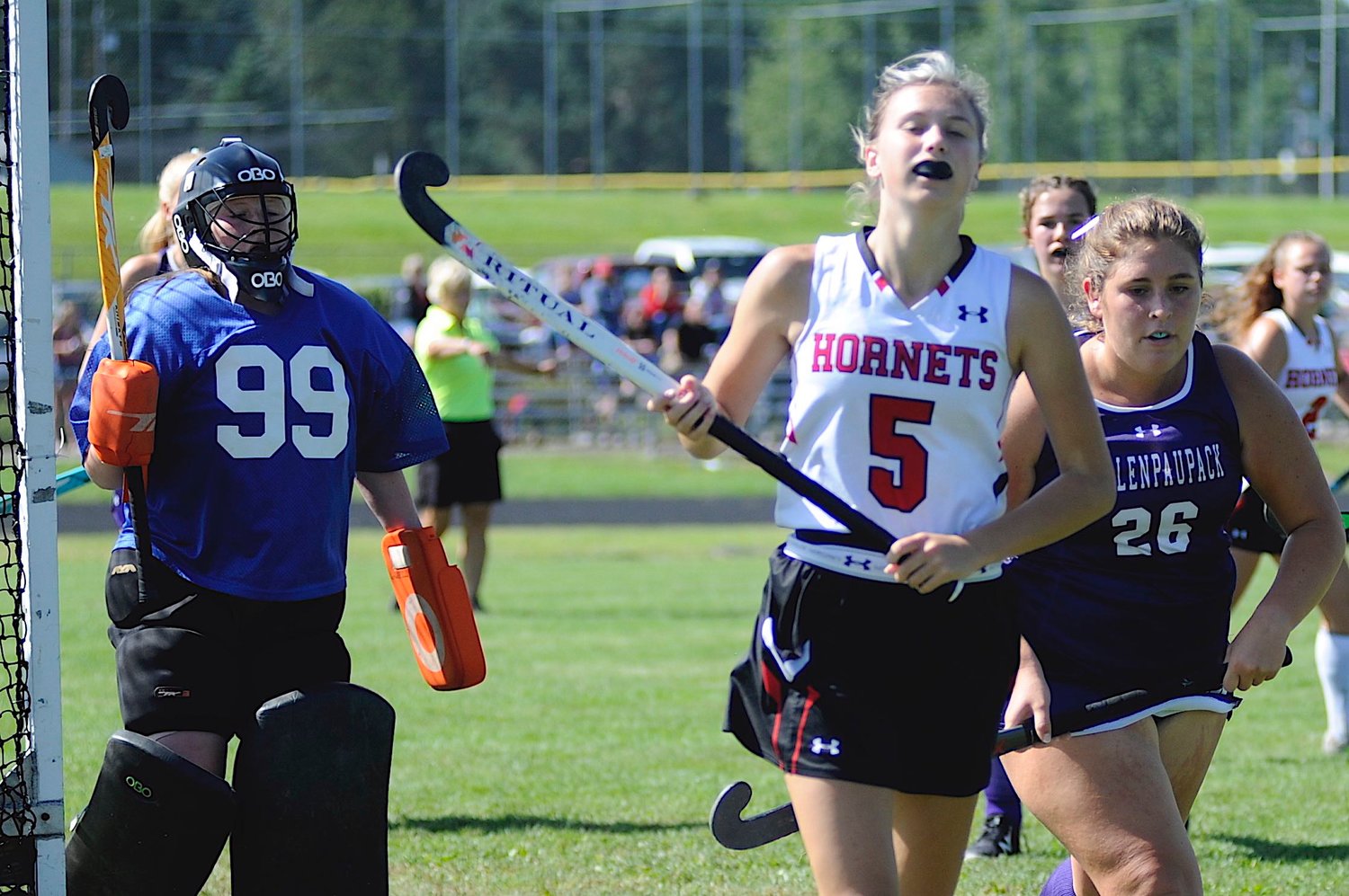 Field hockey action. Honesdale’s Ally Weber-Gump, a senior, is pictured with Lady Buckhorns' 12th-grader co-captain Abigail Calabrese and defending freshman goalie Brenna Conklin.